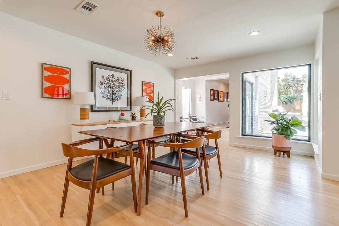 Dining room with a wooden table and upholstered chairs