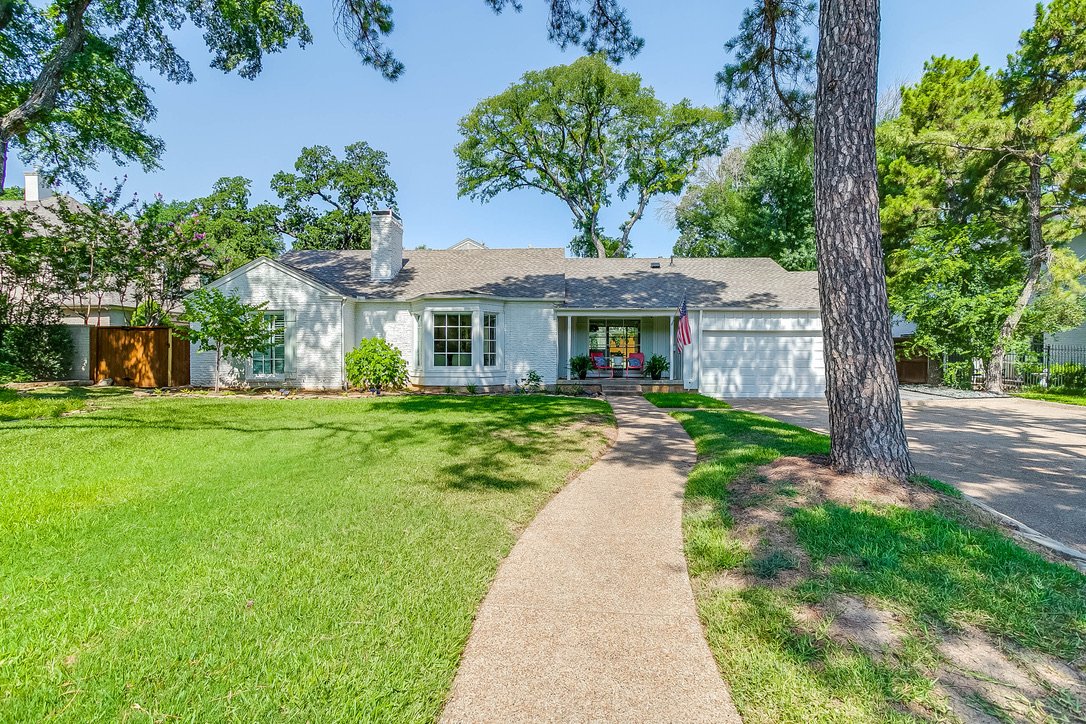 Front lawn with green grass in front of the residence