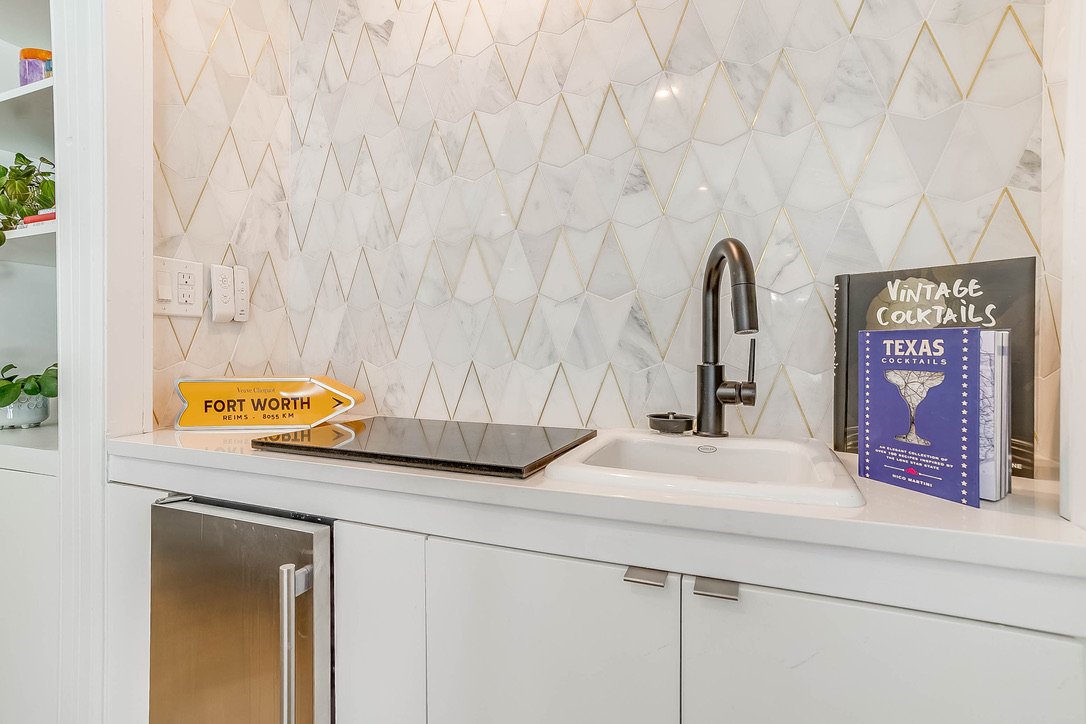 Kitchen counter area with a sink and coffee machine