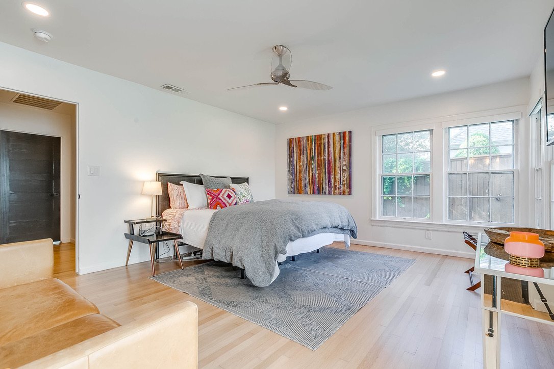Living space and bedroom setup with modern art and furniture — Luxury Mountain Retreat