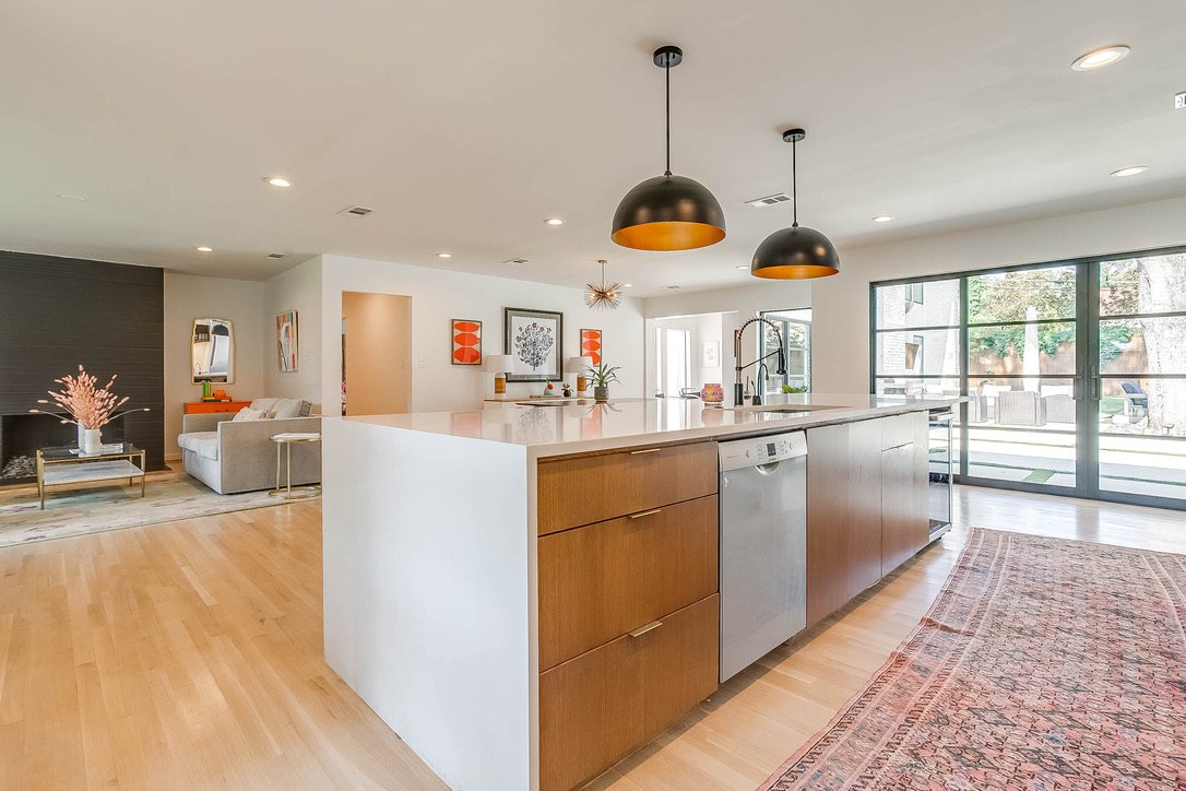Modern kitchen island with surrounding cabinetry