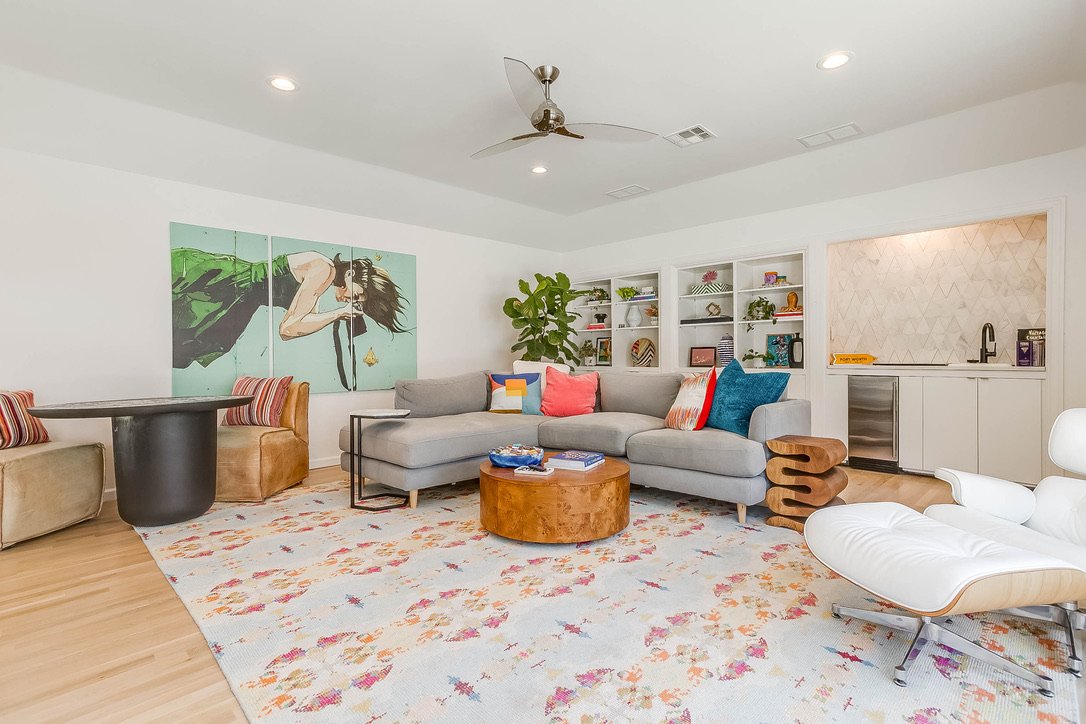 Spacious living room with sofas gathered on an area rug