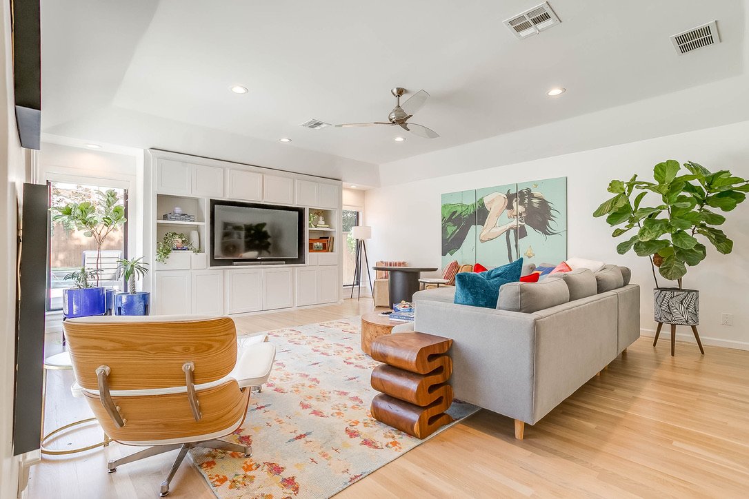 Well-lit living area with lounge chairs and a modern layout